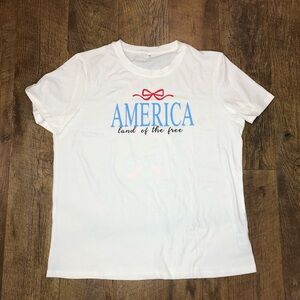 America Land of the Free Women’s Flag Bows Down Back T Shirt White XL
